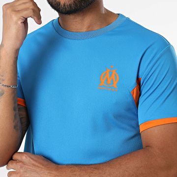 OM - M24090C Camiseta Poliéster Logo Azul Claro Naranja