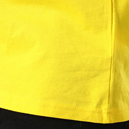 DC Comics - Camiseta con logotipo amarillo