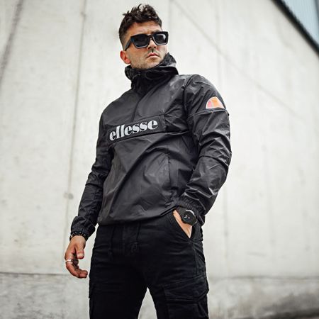 Ellesse - Acera SXG09906 Cortavientos Cuello con Cremallera Reflectante Negro