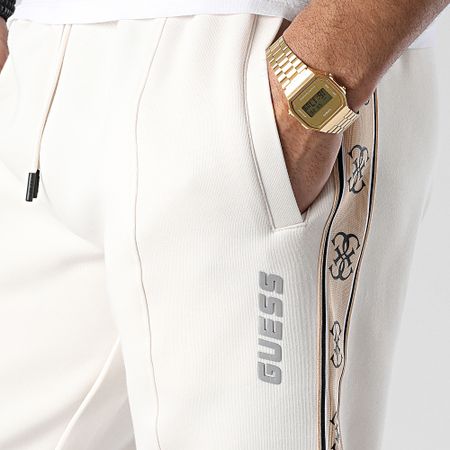 Guess - Pantalones de chándal a rayas Z2YB09-KB3P2 Beige