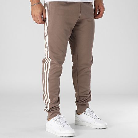 Adidas Originals - SST JP2518 Pantalón de chándal con banda marrón
