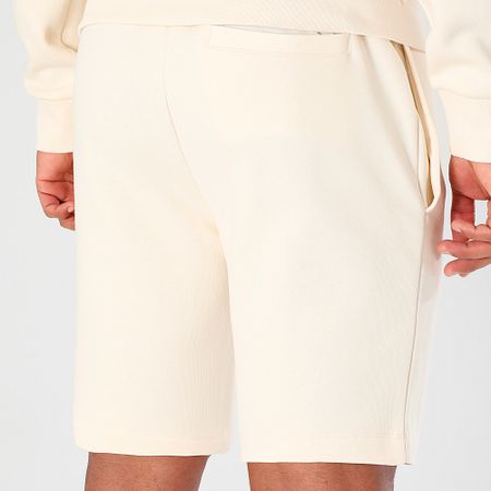 Lacoste - Pantalones cortos de jogging con logotipo bordado en cocodrilo beige